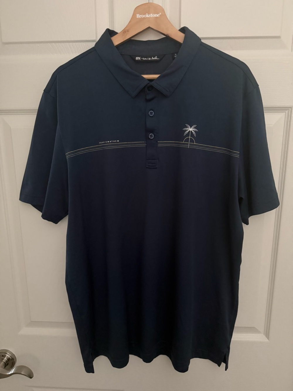 Travis Mathew Navy Polo with Subtle Palm Detail